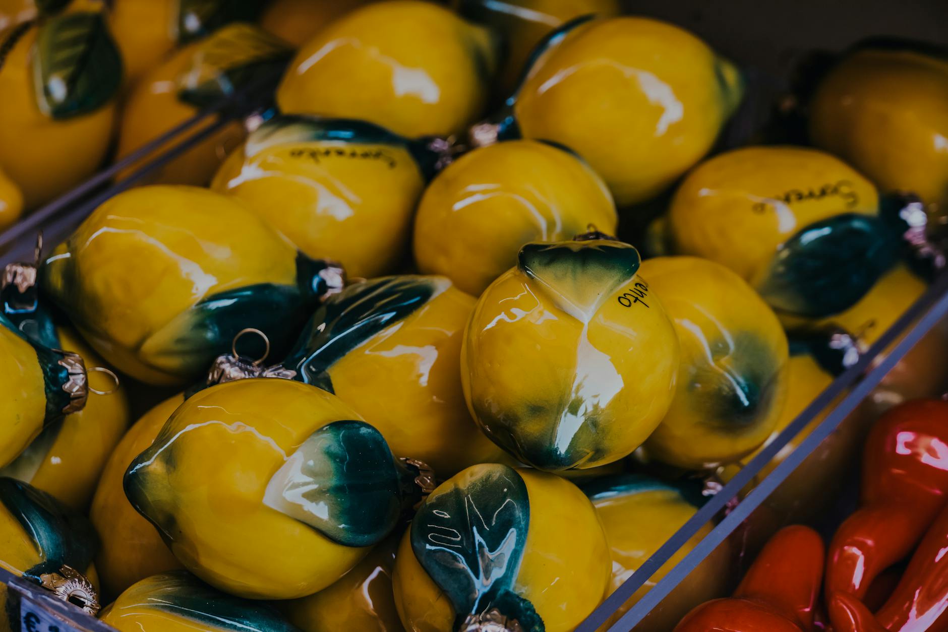 Bright yellow lemons on pastel green background, representing fresh and safe lemon vibrator choices